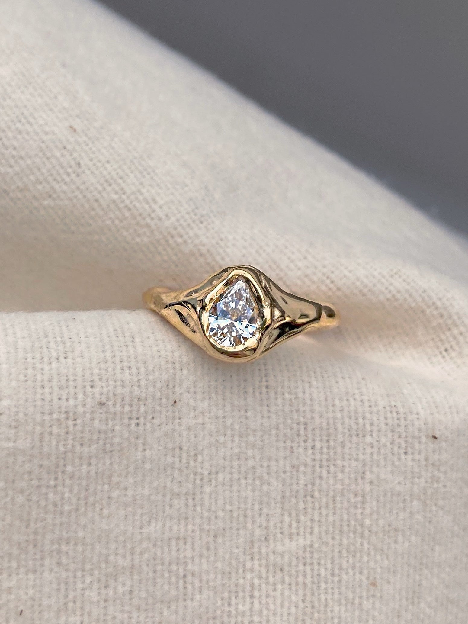 organic pear diamond engagement ring