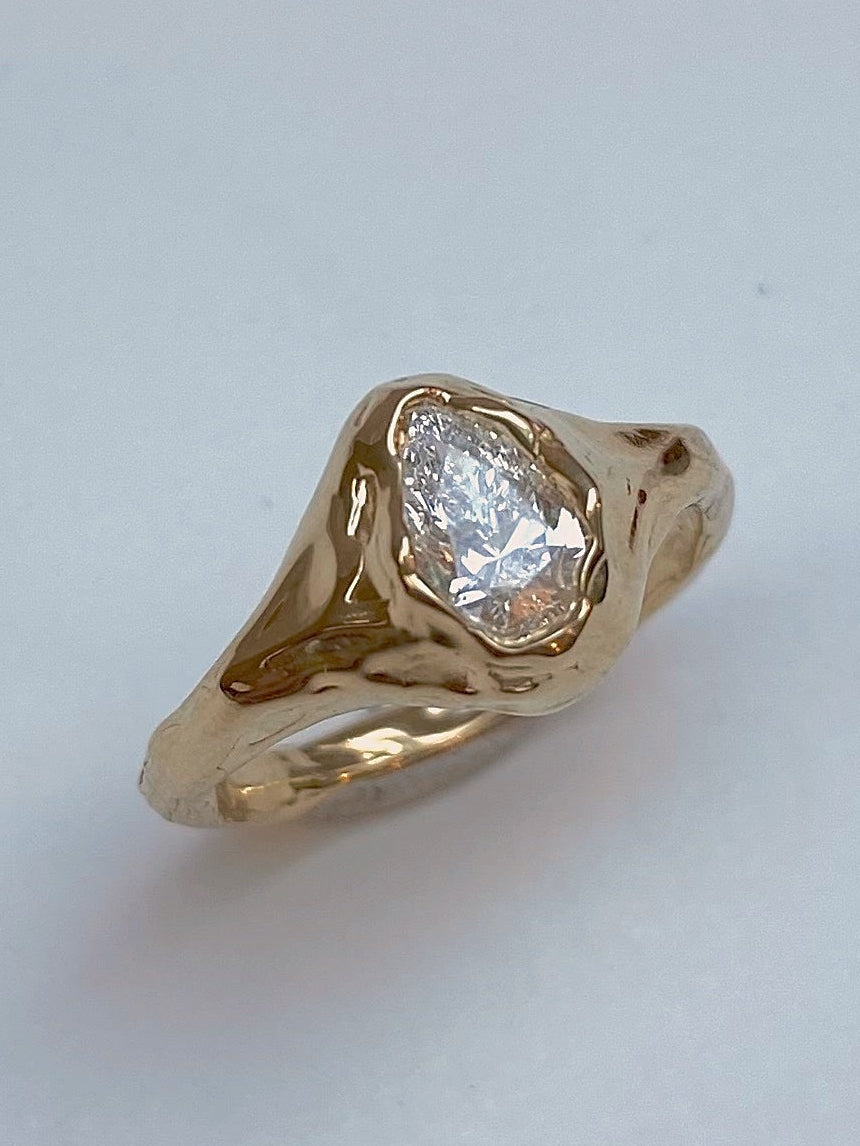 Pear diamond organic engagement ring in 18 karat gold
