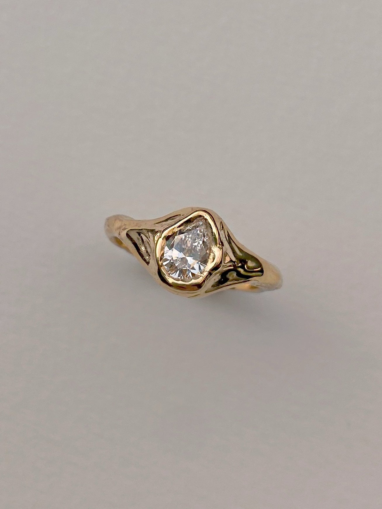 organic pear diamond engagement ring