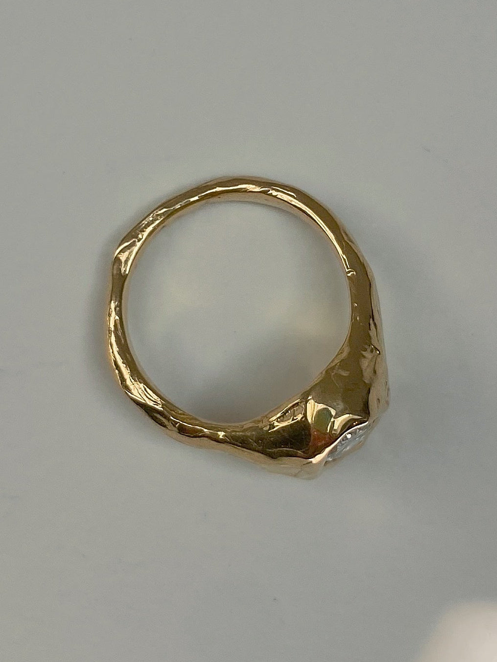 Chunky engagement ring with organic setting 1 carat oval diamond