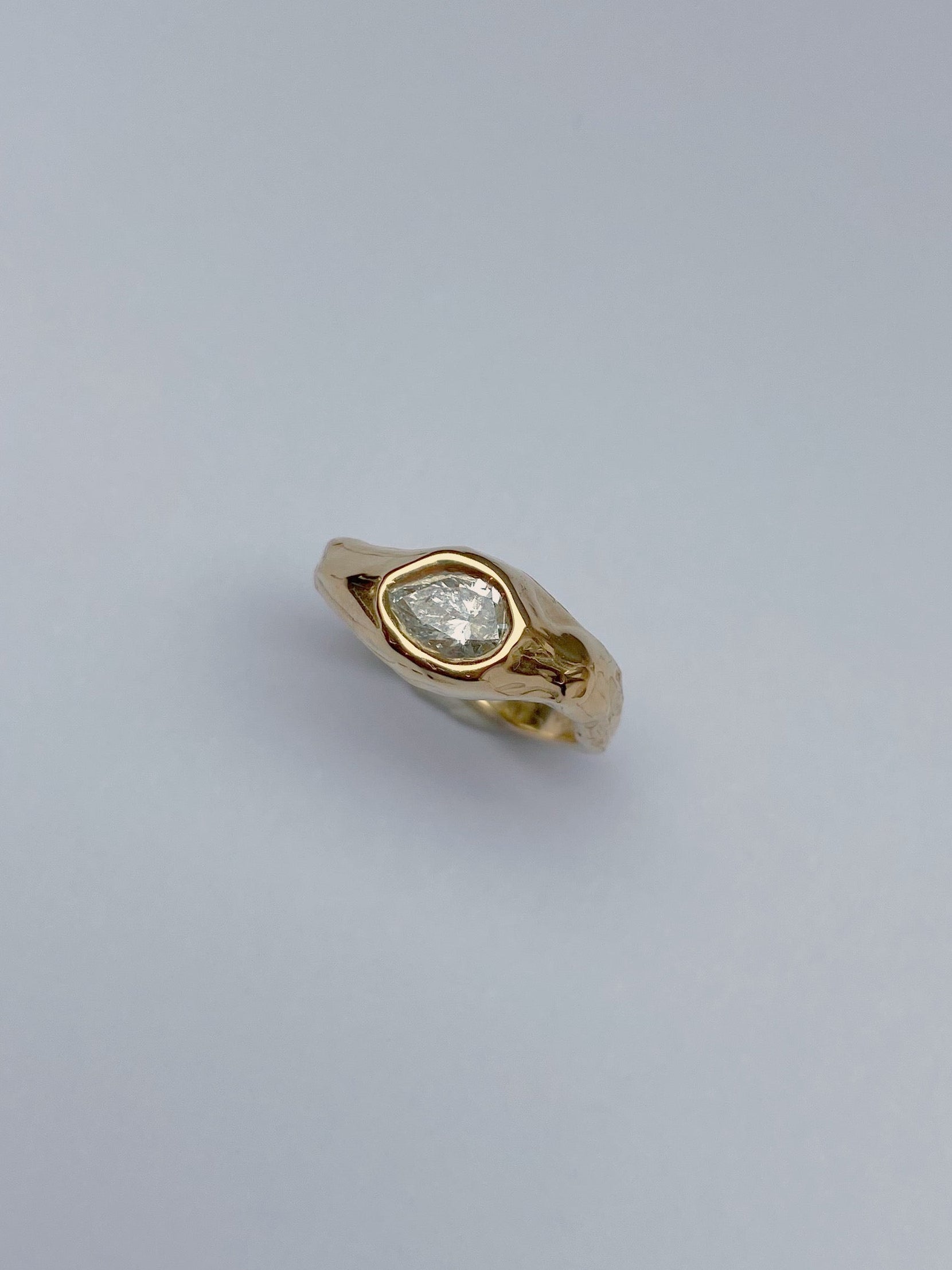 big chunky engagement ring with pear diamond