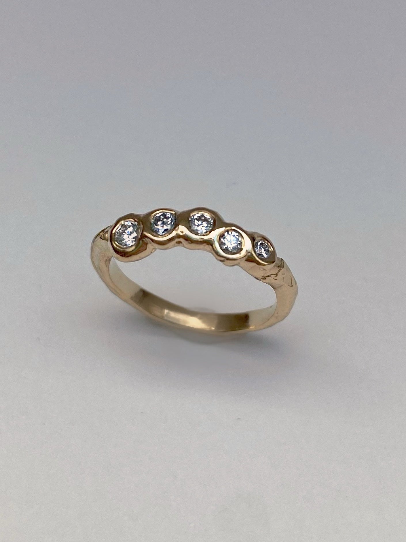 organic wedding ring with five diamond