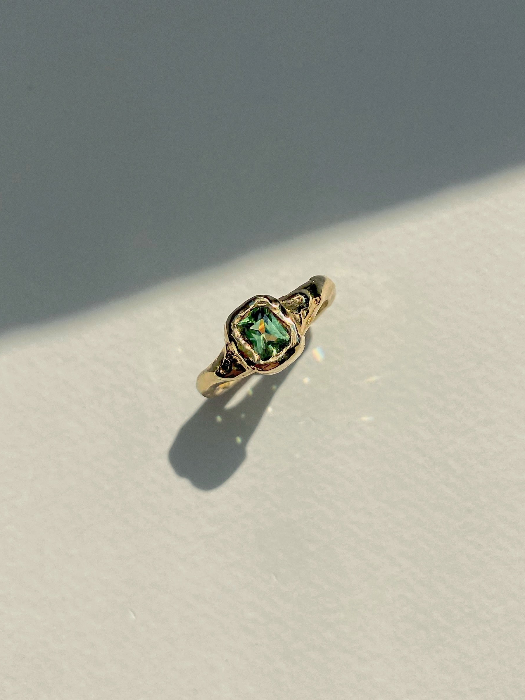 Green sapphire engagement ring