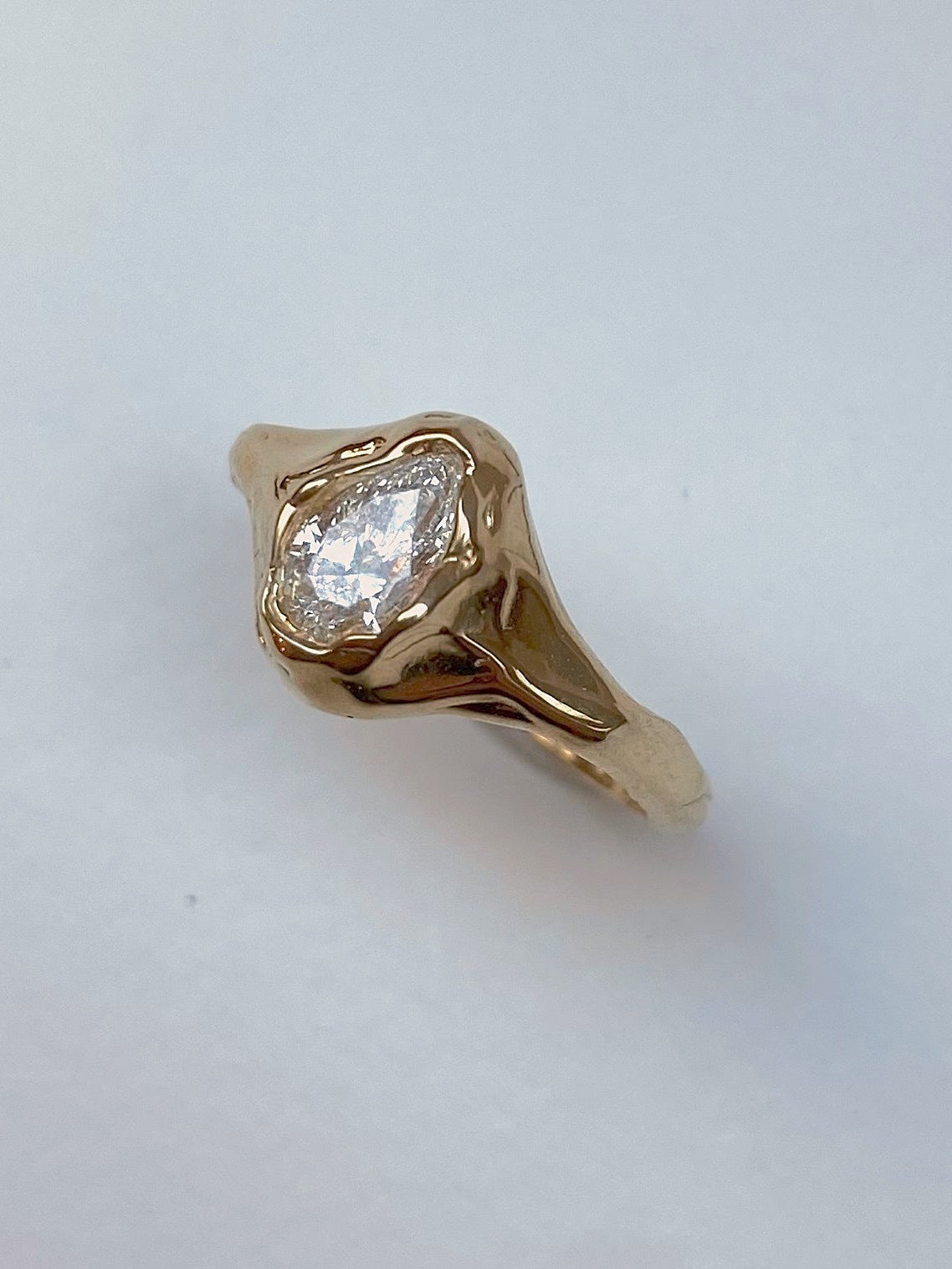 organic ring with chunky setting pear diamond