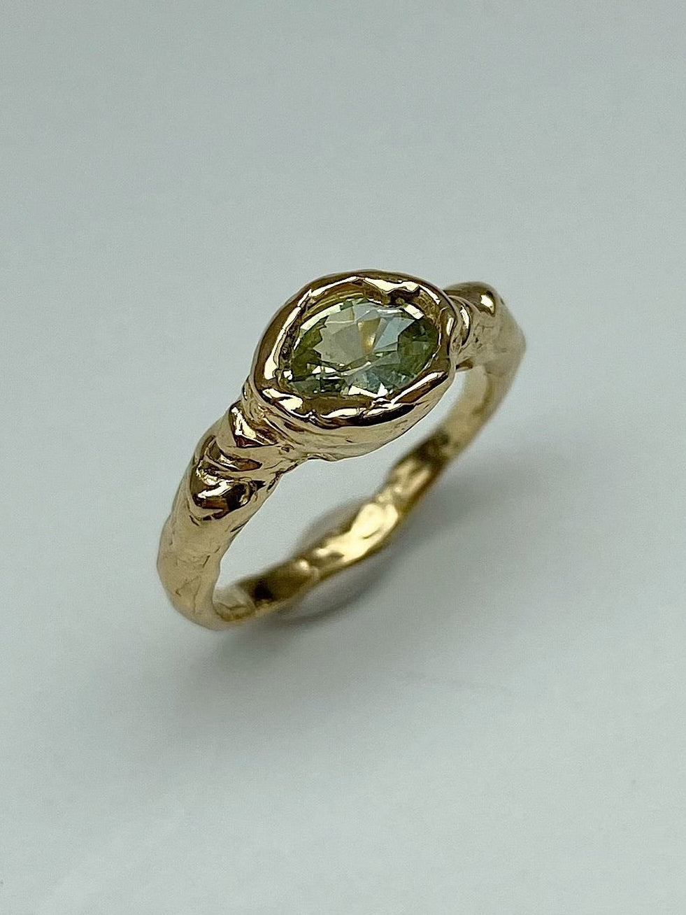 Cool chunky organic engagement ring with oval yellow green diamond