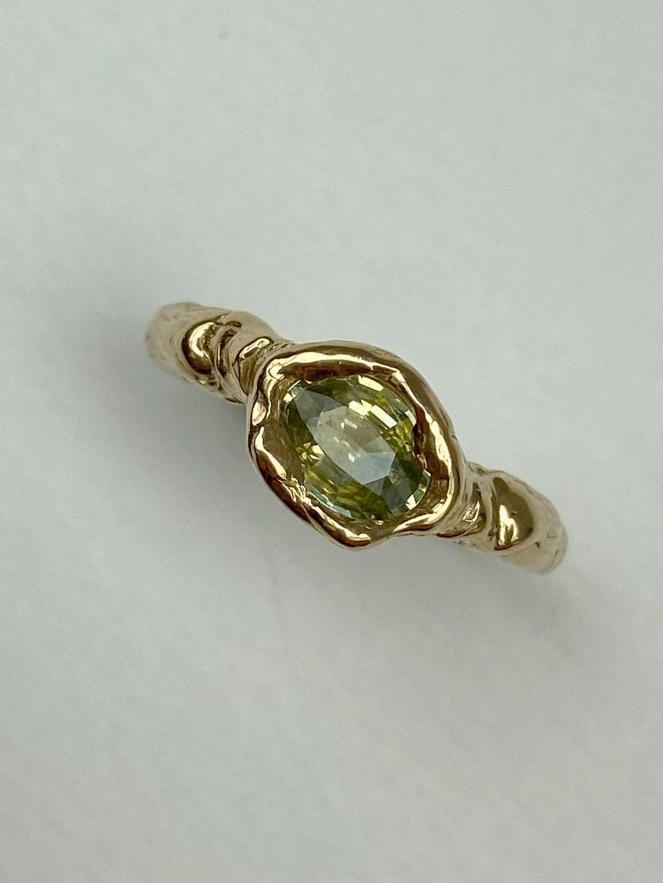 Cool chunky organic engagement ring with oval yellow green diamond