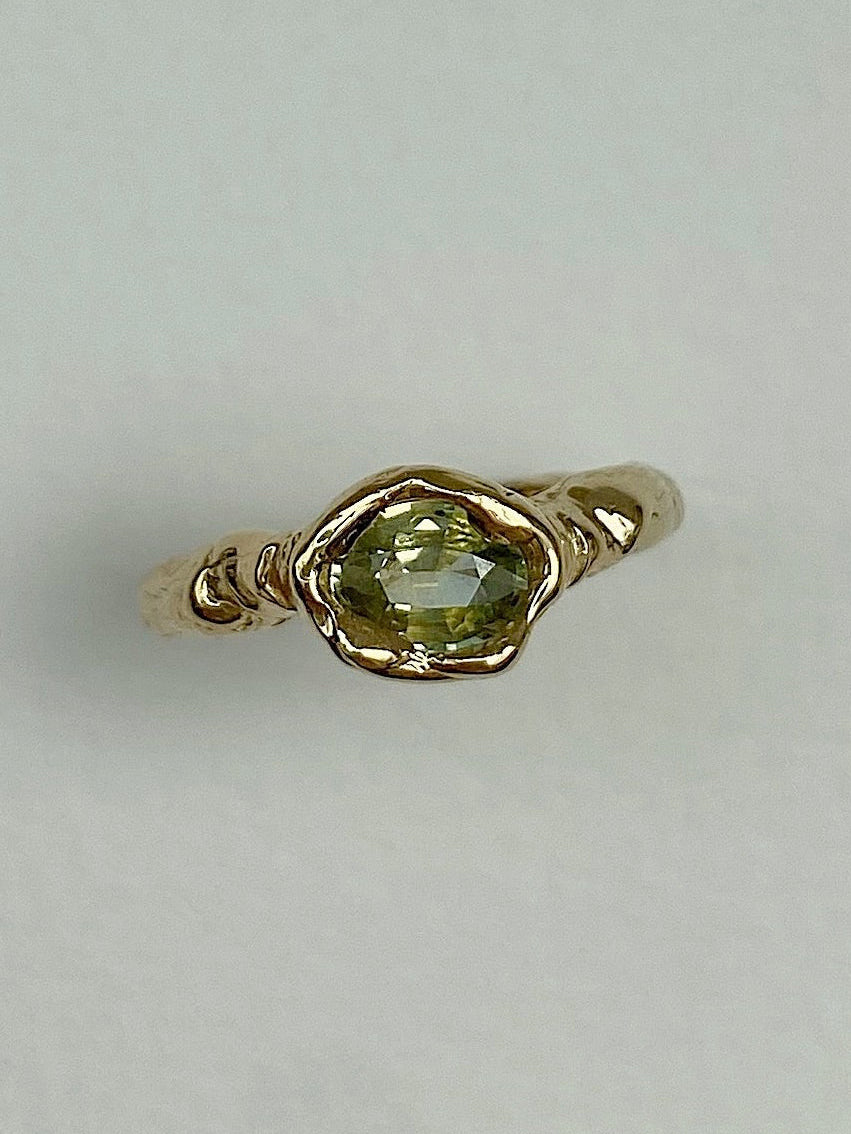 Cool chunky organic engagement ring with oval yellow green diamond