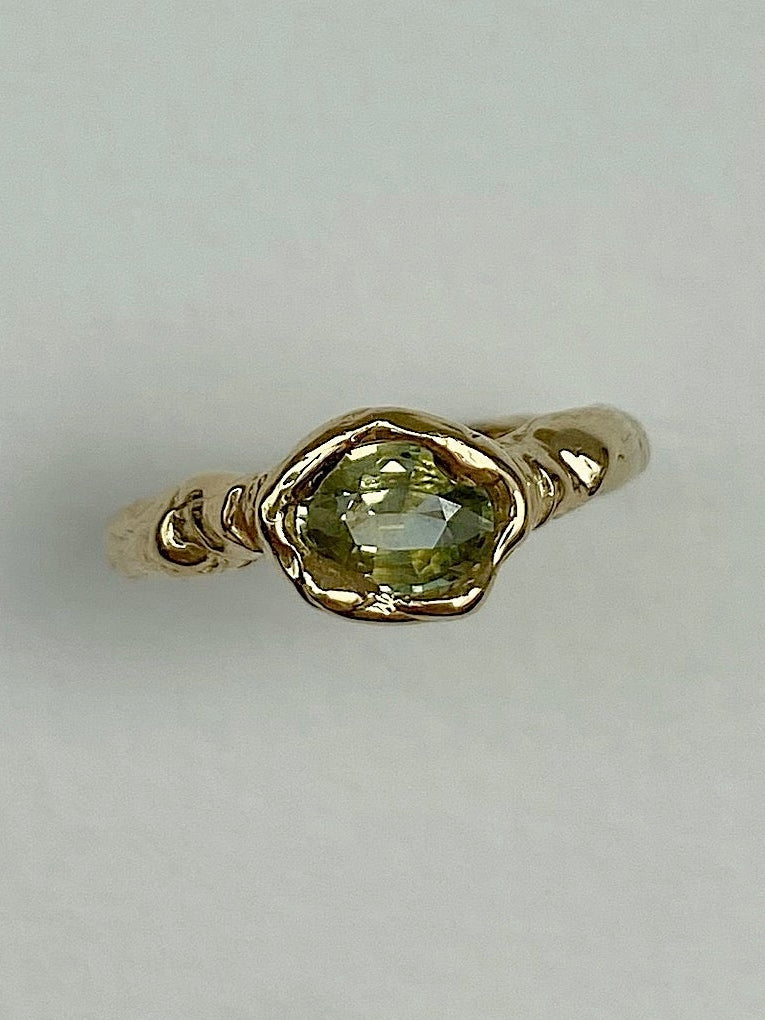 Cool chunky organic engagement ring with oval yellow green diamond