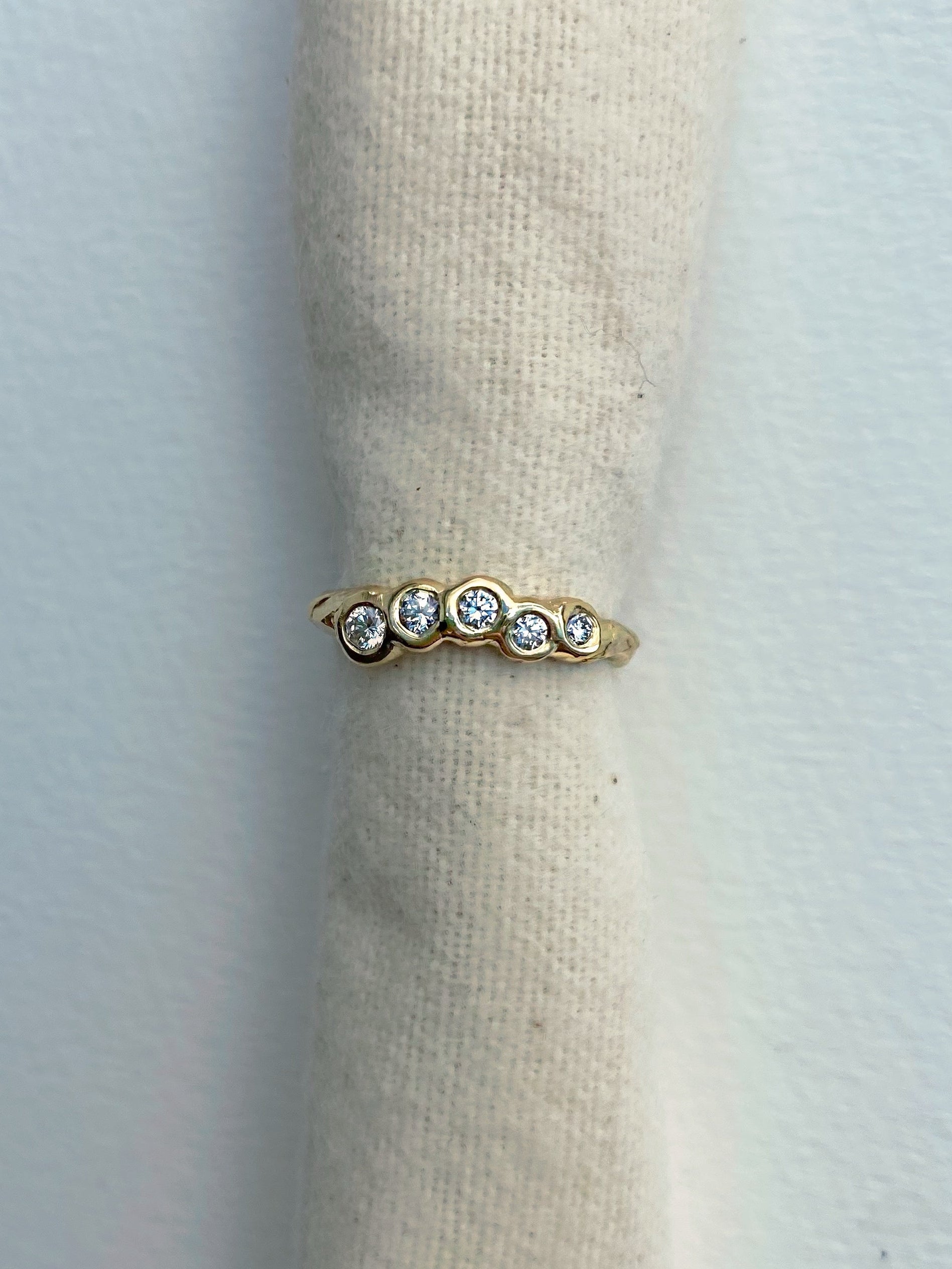 engagement ring with five diamonds